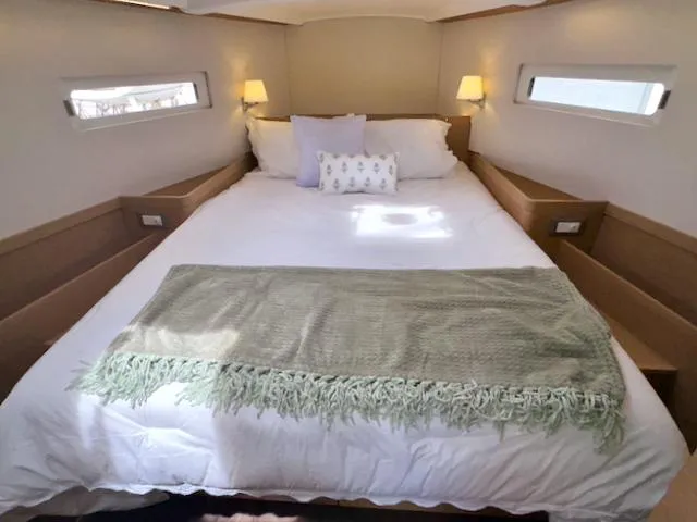 Slide: The Image of Luxurious bedroom interior of 2024 Jeanneau Sun Odyssey 410 yacht with cozy bedding. - 19