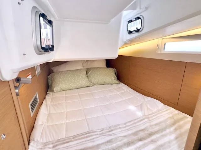 Slide: The Image of Cozy cabin interior of 2024 Jeanneau Sun Odyssey 410 sailboat. - 24