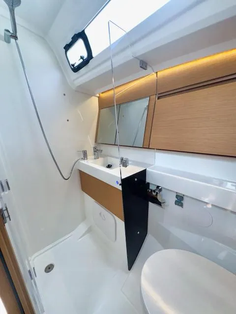 Slide: The Image of 2024 Jeanneau Sun Odyssey 410 bathroom with modern fixtures and sleek design. - 25