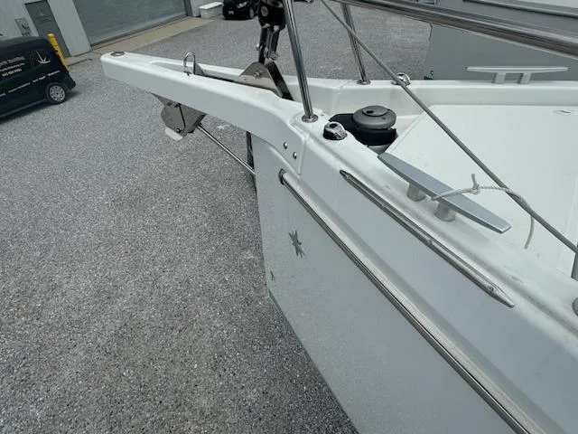 Slide: The Image of 2024 Jeanneau Sun Odyssey 410 yacht bow detail in a marina setting. - 9