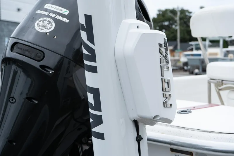 Slide: The Image of Close-up of a 2015 Carolina Skiff 1980 DLX boat motor and Talon anchor system. - 6