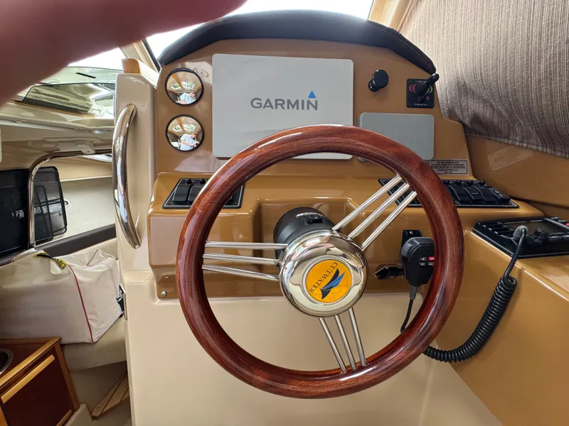 Slide: The Image of Steering wheel of a 2016 Cutwater C-24 boat with Garmin navigation system. - 23