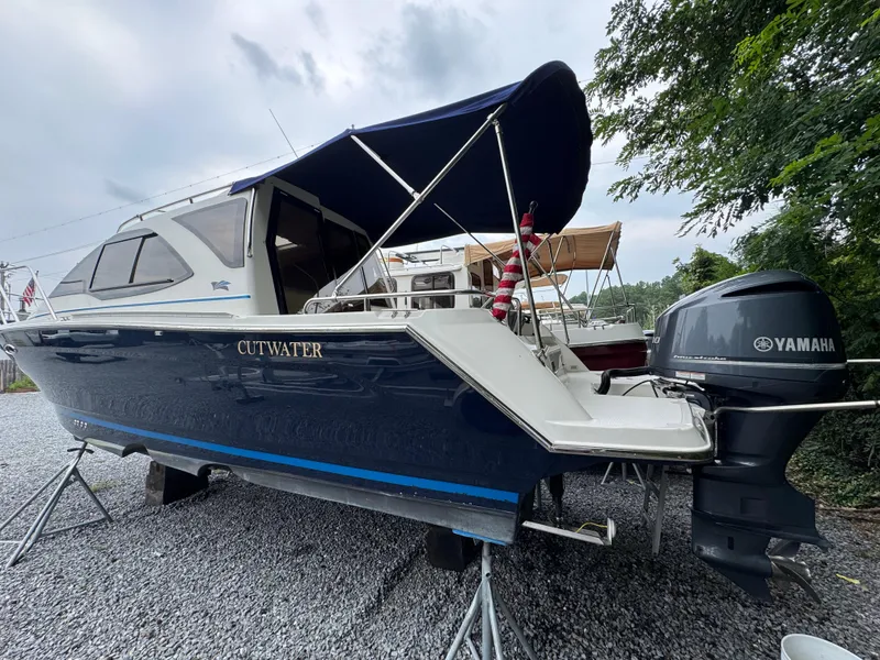 Slide: The Image of 2016 Cutwater C-24 boat with Yamaha outboard motor on gravel lot. - 3