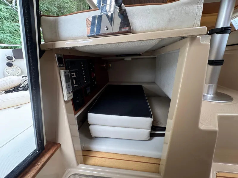 Slide: The Image of Interior cabin of a 2016 Cutwater C-24 boat with seating and control panel. - 30