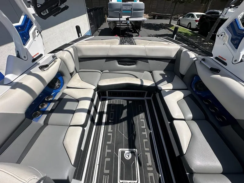 Slide: The Image of 2021 Centurion Fi23 boat interior with luxurious seating and modern design. - 14
