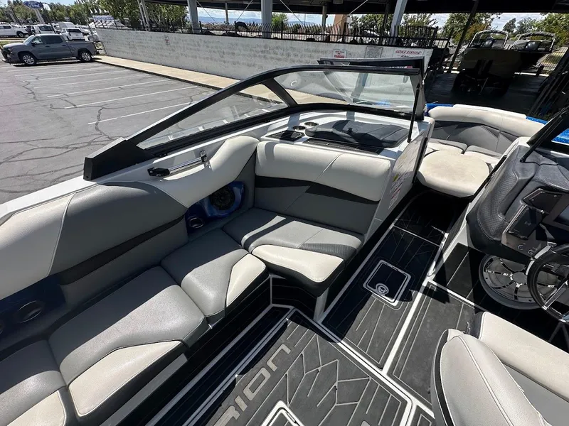 Slide: The Image of 2021 Centurion Fi23 boat interior with gray seating and modern dashboard design. - 18