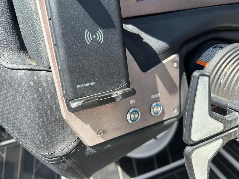 Slide: The Image of Control panel of a 2021 Centurion Fi23 boat with Scanstrut wireless charger. - 22