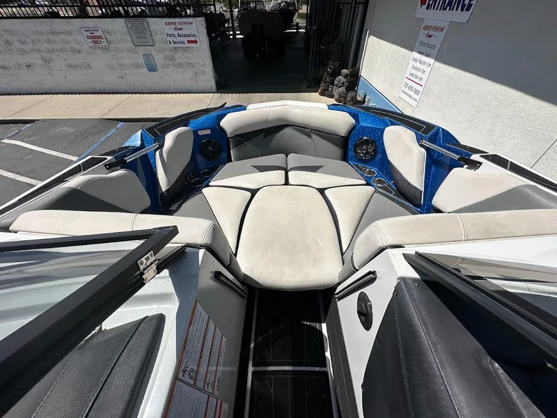 Slide: The Image of 2021 Centurion Fi23 boat interior with cushioned seating and cup holders. - 25