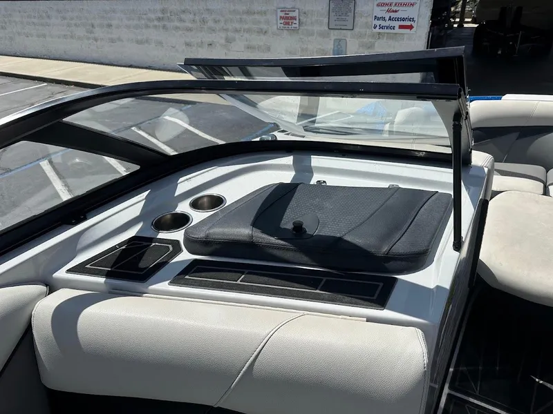 Slide: The Image of Interior of 2021 Centurion Fi23 boat with cup holders and seating area. - 34