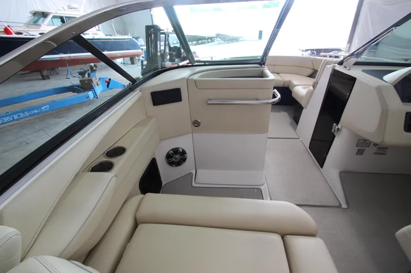 Slide: The Image of 2021 Regal 2800 Bowrider interior with beige seating and modern design. - 20