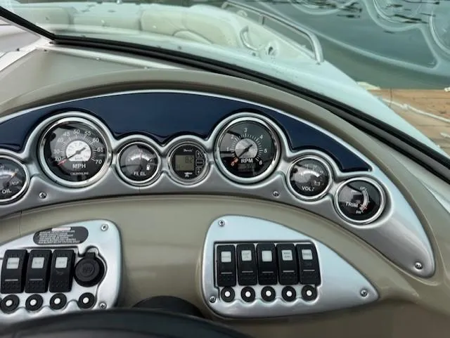 Slide: The Image of Dashboard of a 2008 Crownline 240 EX boat with gauges and controls. - 6