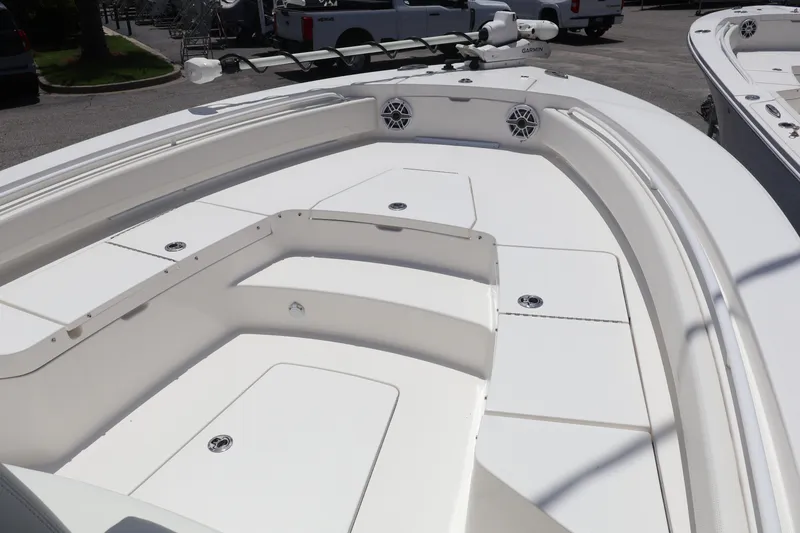 Slide: The Image of 2025 Regulator 26XO boat interior with spacious seating and storage compartments. - 4