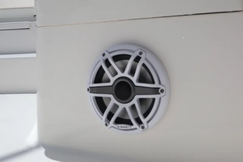 Slide: The Image of Speaker on 2025 Regulator 26XO boat, featuring sleek white design. - 8