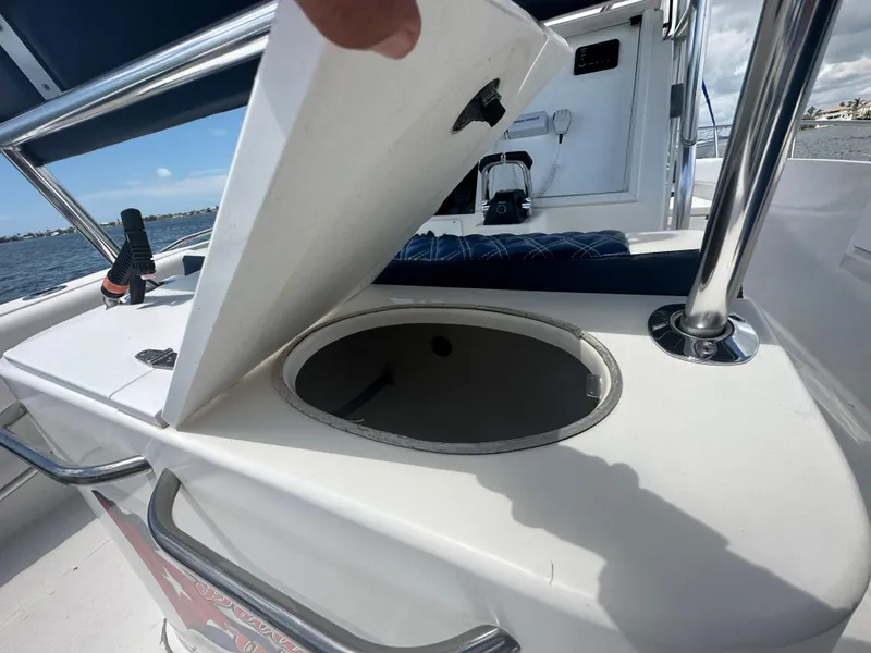 Slide: The Image of 2000 Stamas 290 Tarpon boat with open storage compartment on deck. - 15