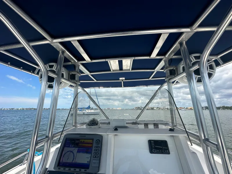 Slide: The Image of View from the helm of a 2000 Stamas 290 Tarpon boat on the water. - 17