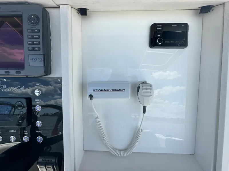 Slide: The Image of Control panel of a 2000 Stamas 290 Tarpon boat with Standard Horizon radio. - 24