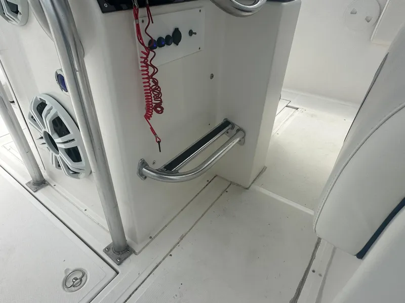 Slide: The Image of Interior view of 2000 Stamas 290 Tarpon boat showing control panel and seating area. - 26