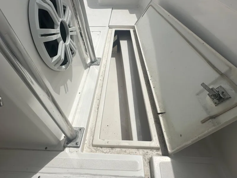 Slide: The Image of Open storage compartment on a 2000 Stamas 290 Tarpon boat. - 33