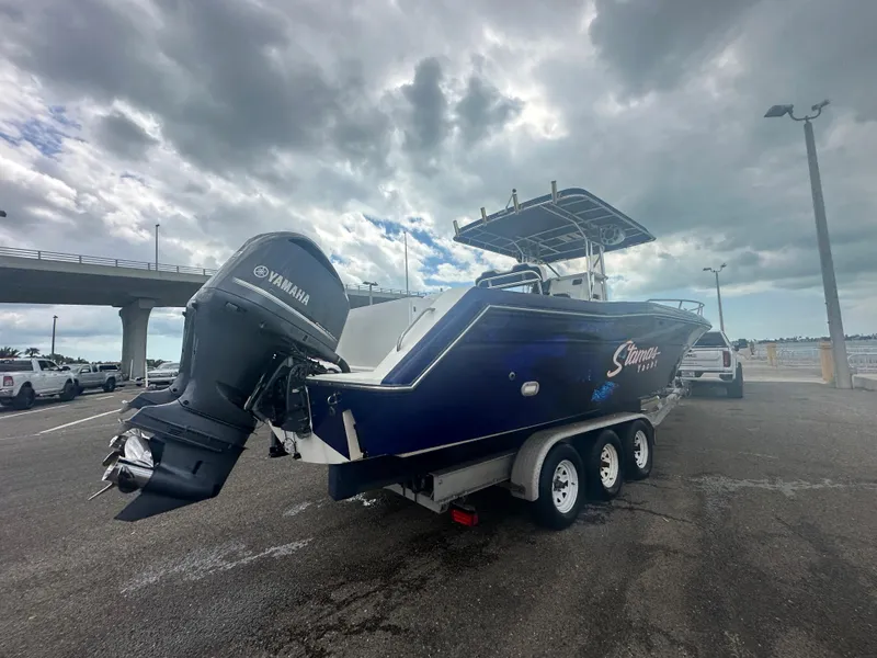 Slide: The Image of 2000 Stamas 290 Tarpon boat on trailer with Yamaha outboard motor. - 41