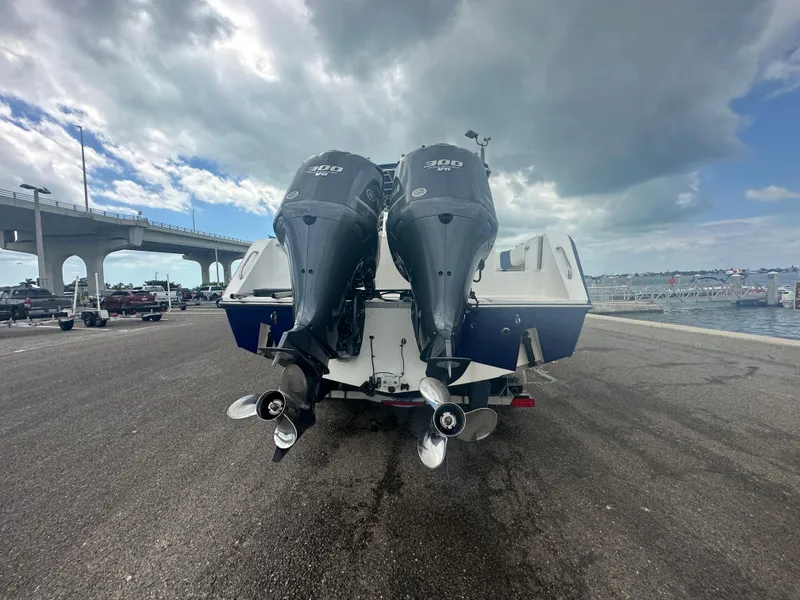 Slide: The Image of 2000 Stamas 290 Tarpon boat with twin outboard motors at a marina. - 44