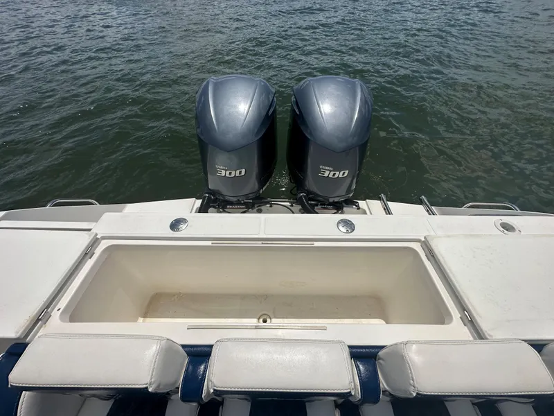 Slide: The Image of 2000 Stamas 290 Tarpon boat with twin 300 horsepower engines on water. - 6