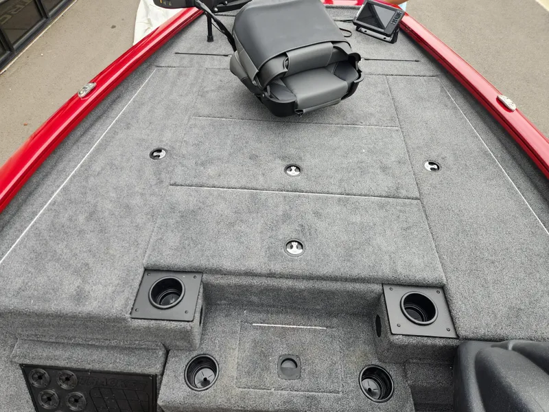 Slide: The Image of 2026 Tracker Pro Team 195 boat deck with gray carpet and red trim. - 10