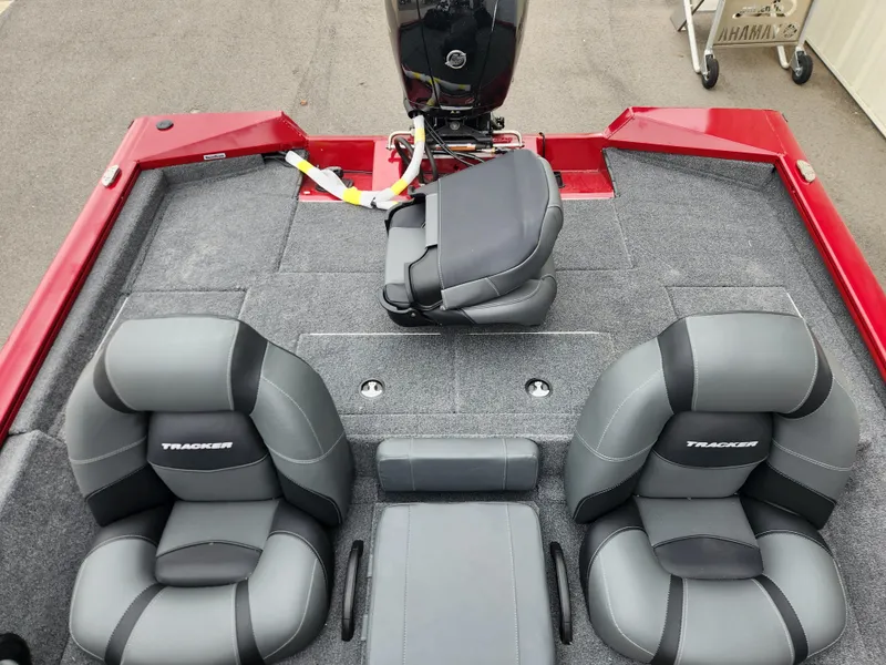 Slide: The Image of 2026 Tracker Pro Team 195 boat interior with gray seating and red accents. - 11
