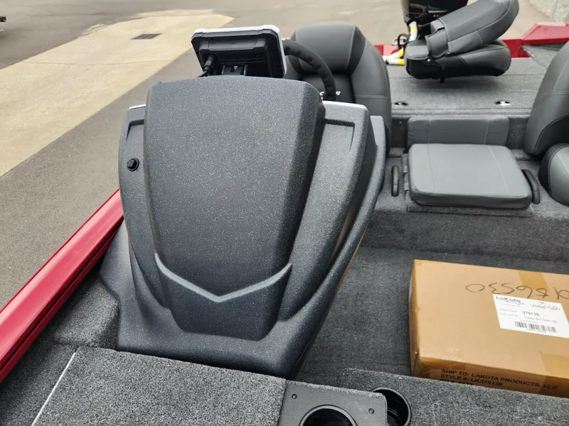 Slide: The Image of 2026 Tracker Pro Team 195 boat interior with seats and console, featuring a cardboard box. - 12