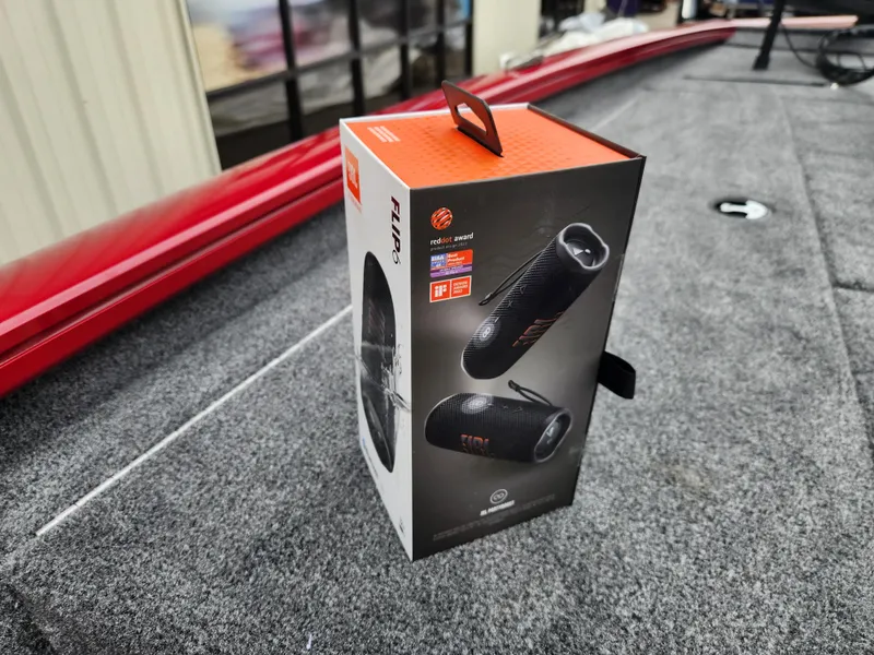 Slide: The Image of Boxed JBL Flip 6 speaker on 2026 Tracker Pro Team 195 boat deck. - 15