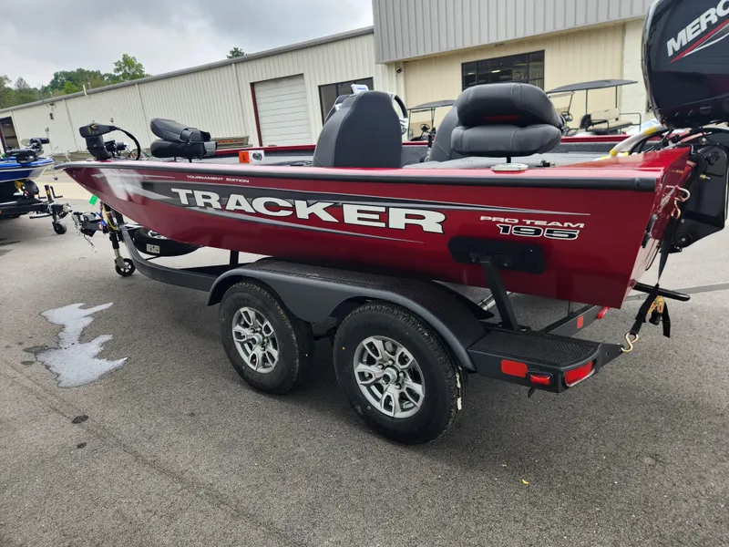 Slide: The Image of 2026 Tracker Pro Team 195 boat on trailer, red exterior, parked outdoors. - 5