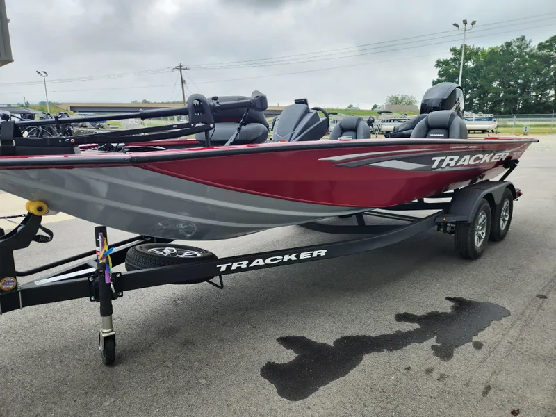 Slide: The Image of 2026 Tracker Pro Team 195 boat on trailer, red and gray design, parked outdoors. - 6