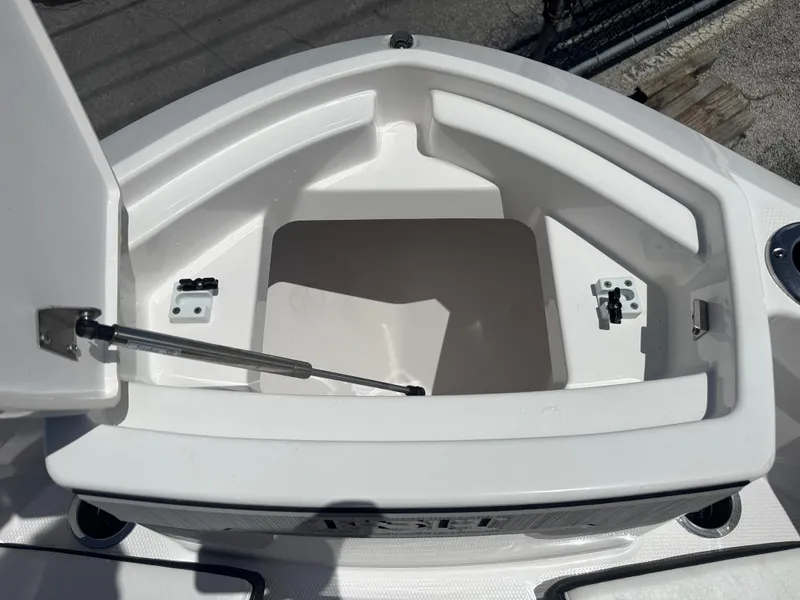 Slide: The Image of Open storage compartment on 2024 Yamaha Boats 255 FSH Sport E. - 10