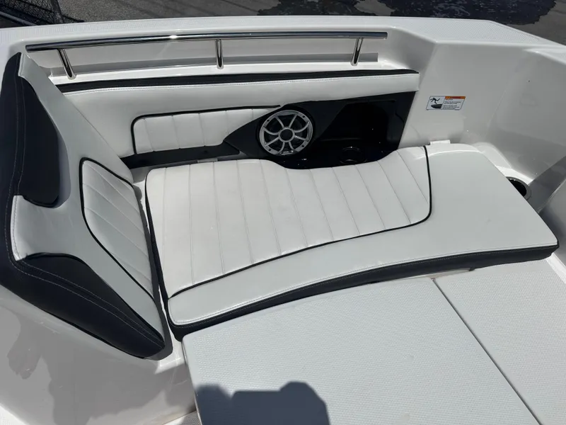 Slide: The Image of 2024 Yamaha Boats 255 FSH Sport E interior seating with speaker detail. - 13