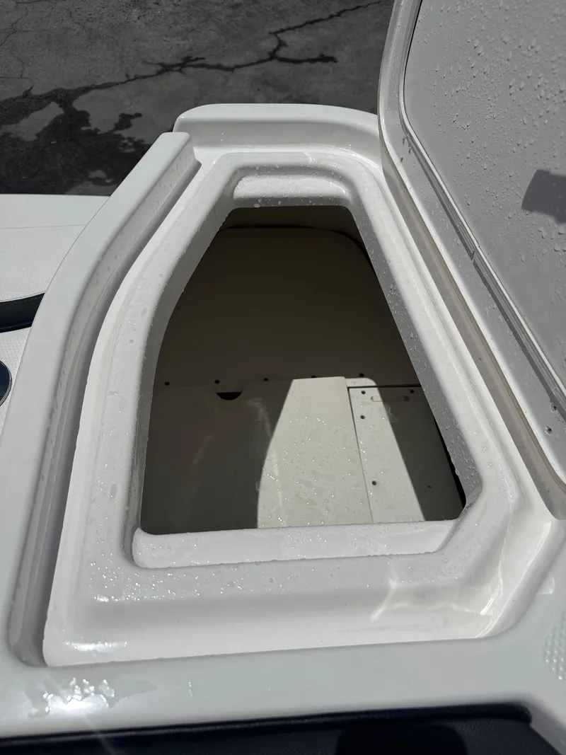 Slide: The Image of Open storage compartment on 2024 Yamaha Boats 255 FSH Sport E. - 24