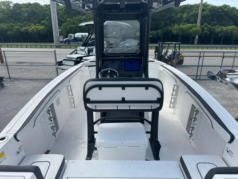 Slide: The Image of 2024 Yamaha Boats 255 FSH Sport E interior with steering console and seating. - 3