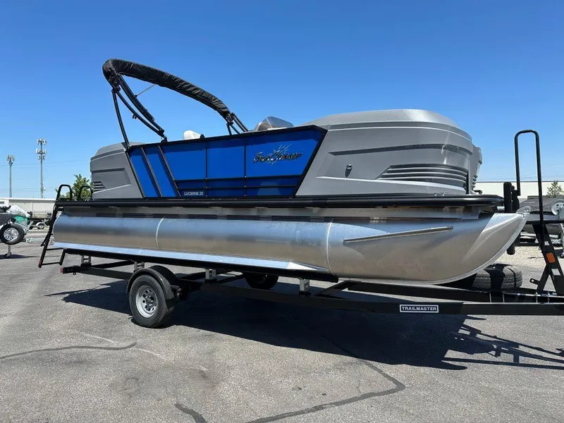 Slide: The Image of 2026 SunChaser Lucerne 20 LR DH pontoon boat on trailer, blue and gray design. - 1