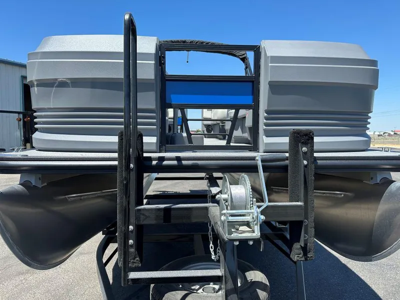 Slide: The Image of 2026 SunChaser Lucerne 20 LR DH pontoon boat on trailer, viewed from the front. - 2
