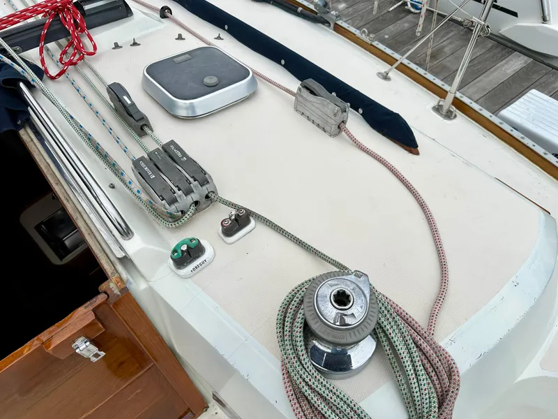 Slide: The Image of Deck of 1998 Sabre 362 sailboat with ropes and winch. - 10