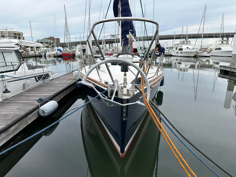 Slide: The Image of Sailboat Sabre 362, 1998 model, docked in a marina with calm waters. - 2