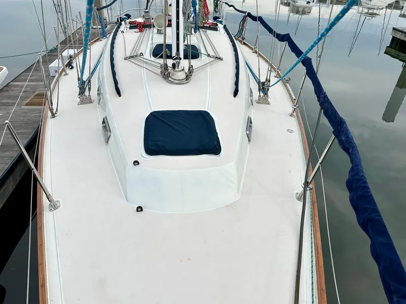 Slide: The Image of 1998 Sabre 362 sailboat deck with blue covers and rigging at dock. - 3