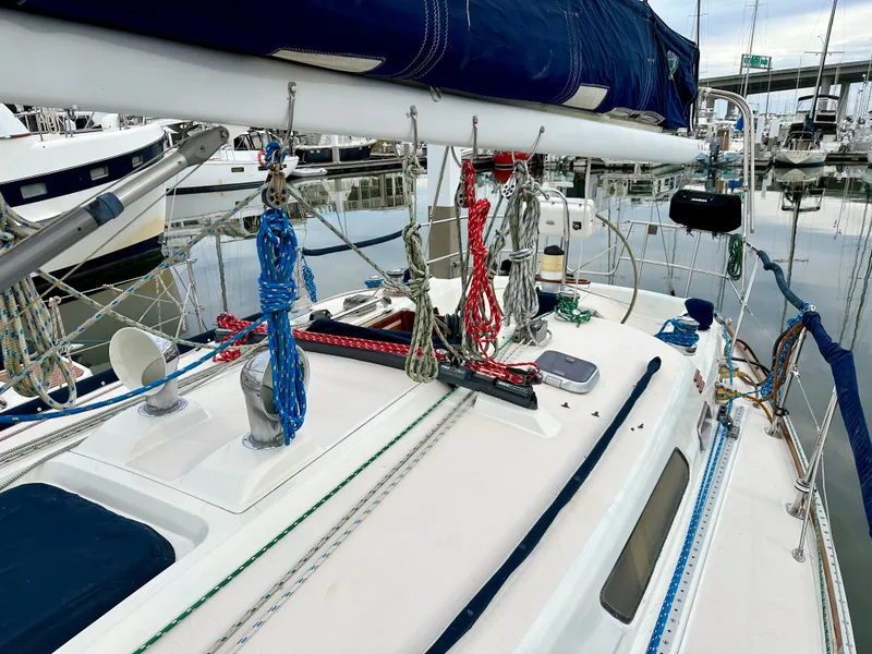 Slide: The Image of 1998 Sabre 362 sailboat deck with rigging and marina background. - 5