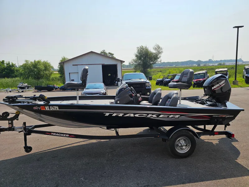 Slide: The Image of 2023 Tracker Pro Team 175 TXW boat on trailer, parked outdoors. - 4
