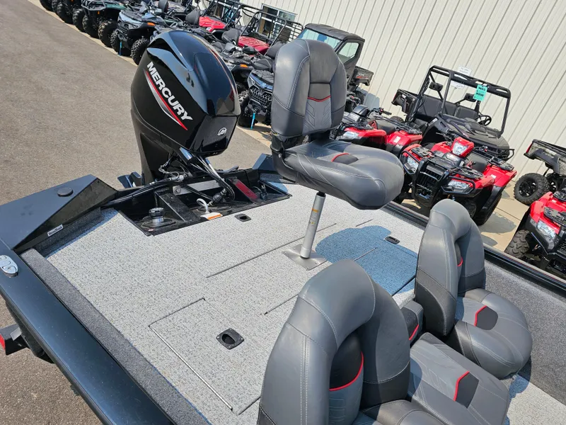 Slide: The Image of 2023 Tracker Pro Team 175 TXW boat with Mercury engine and gray seating. - 8