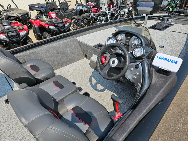 Slide: The Image of 2023 Tracker Pro Team 175 TXW boat interior with steering wheel and Lowrance device. - 9
