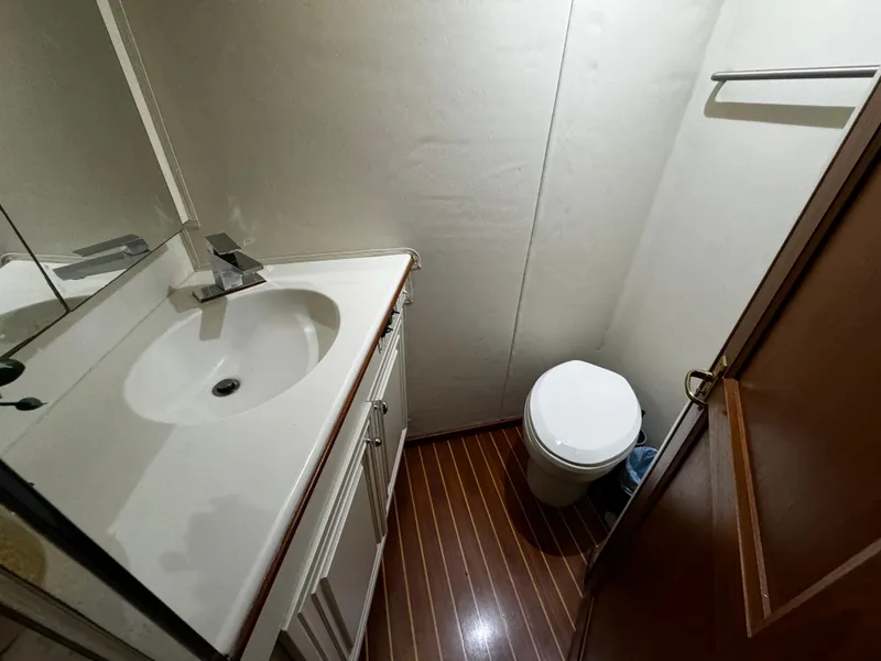 Slide: The Image of Bathroom interior of 1992 Ocean Yachts 48 Convertible with sink and toilet. - 7