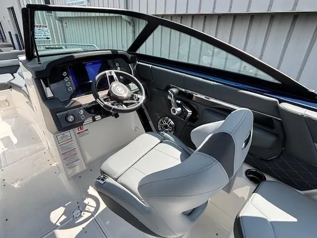 Slide: The Image of 2026 Chaparral SSX 6 boat interior with modern dashboard and steering wheel. - 12