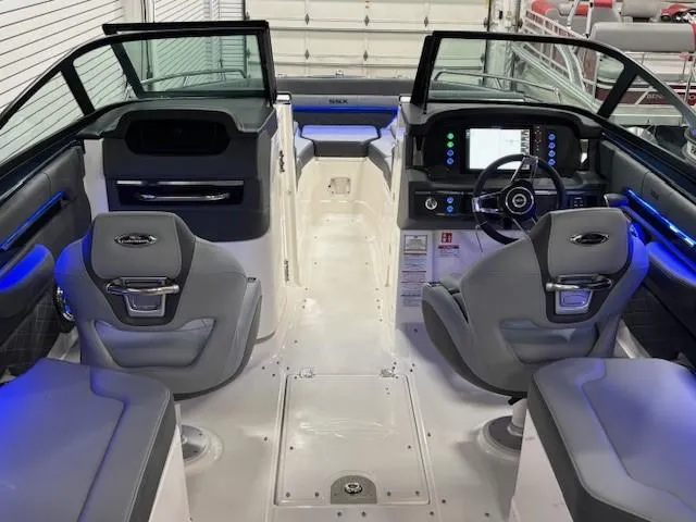 Slide: The Image of 2026 Chaparral SSX 6 boat interior with modern dashboard and seating. - 15
