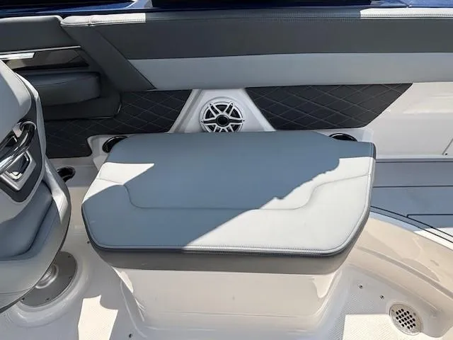 Slide: The Image of 2026 Chaparral SSX 6 boat interior with cushioned seating and speaker detail. - 18