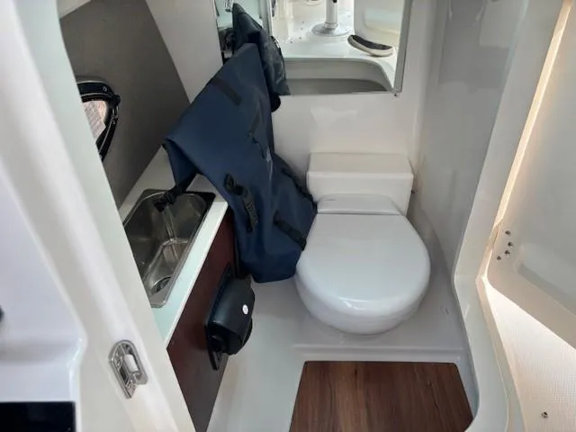 Slide: The Image of Compact bathroom in 2026 Chaparral SSX 6 boat with sink and toilet. - 28