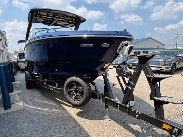 Slide: The Image of 2026 Chaparral SSX 6 boat on trailer, parked outdoors under a clear sky. - 33
